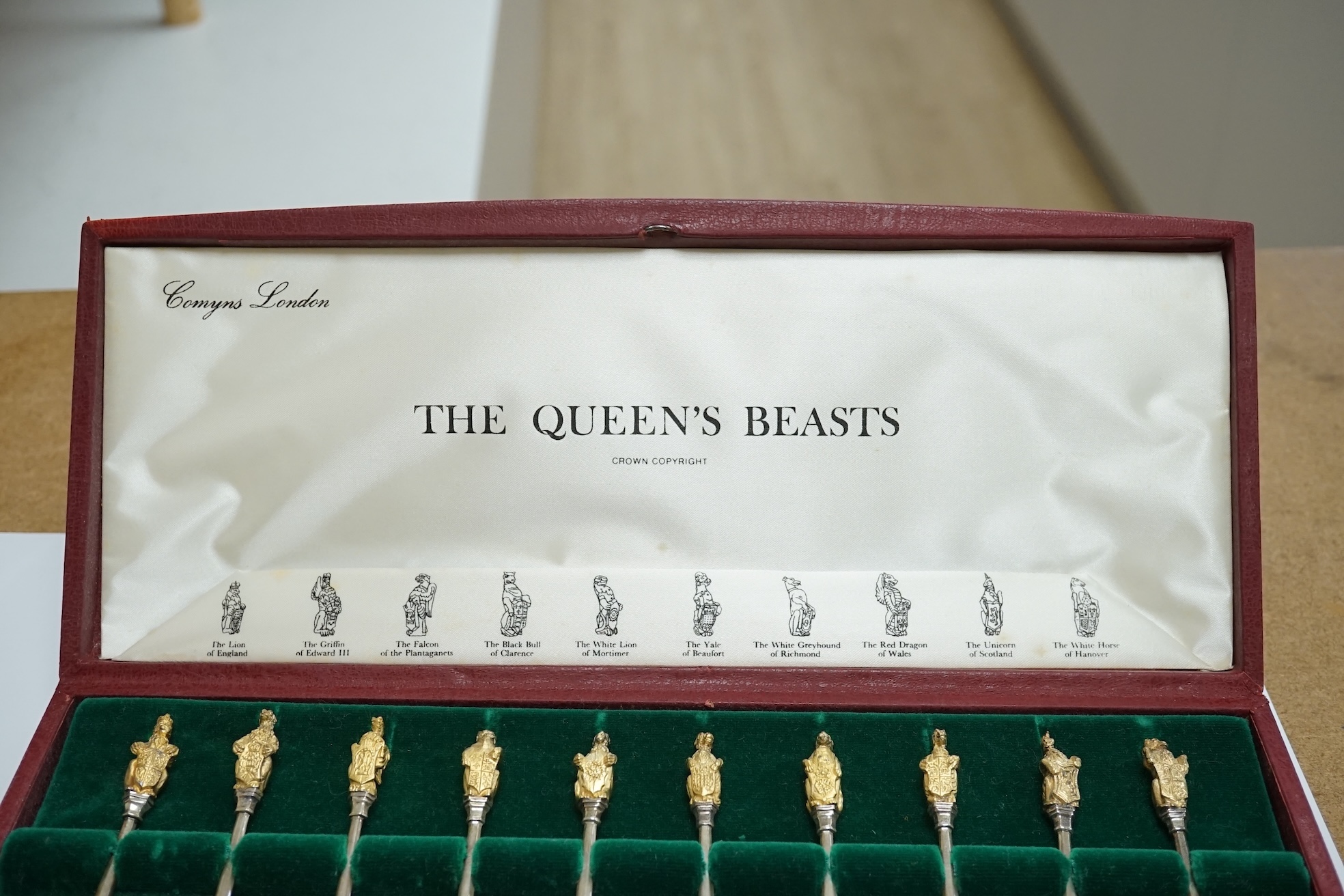 A cased set of ten parcel gilt silver 'The Queens Beasts' Elizabeth II Silver Wedding Anniversary commemorative spoons, William Comyns & Sons Ltd, London, 1972, 11.6cm. Condition - fair to good